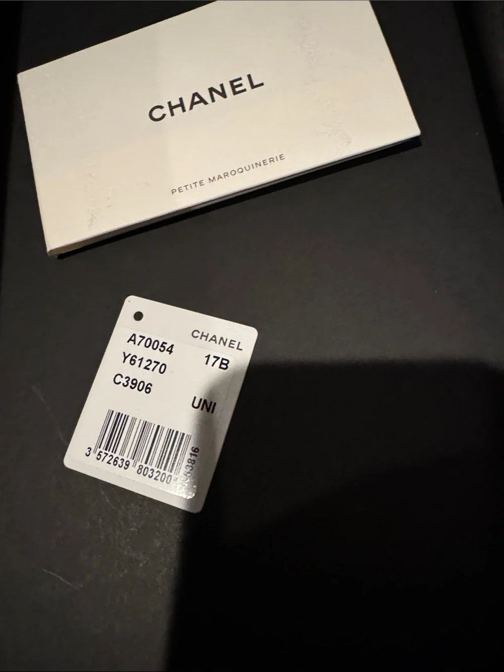 CHANEL women Black Leather Pouch with Gold CC Emblem